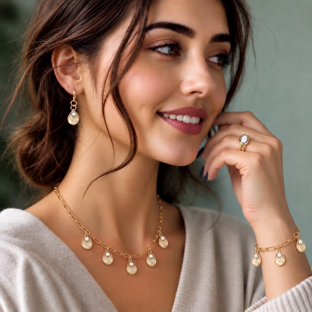 Pontchartrain Collection gold oyster shell pearl charm necklace, bracelet, and earrings