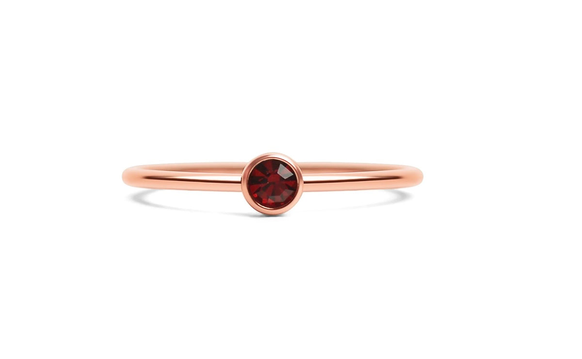 The Addison Stack Ring shown layered in a stack of rings, from Garden District Jewelry