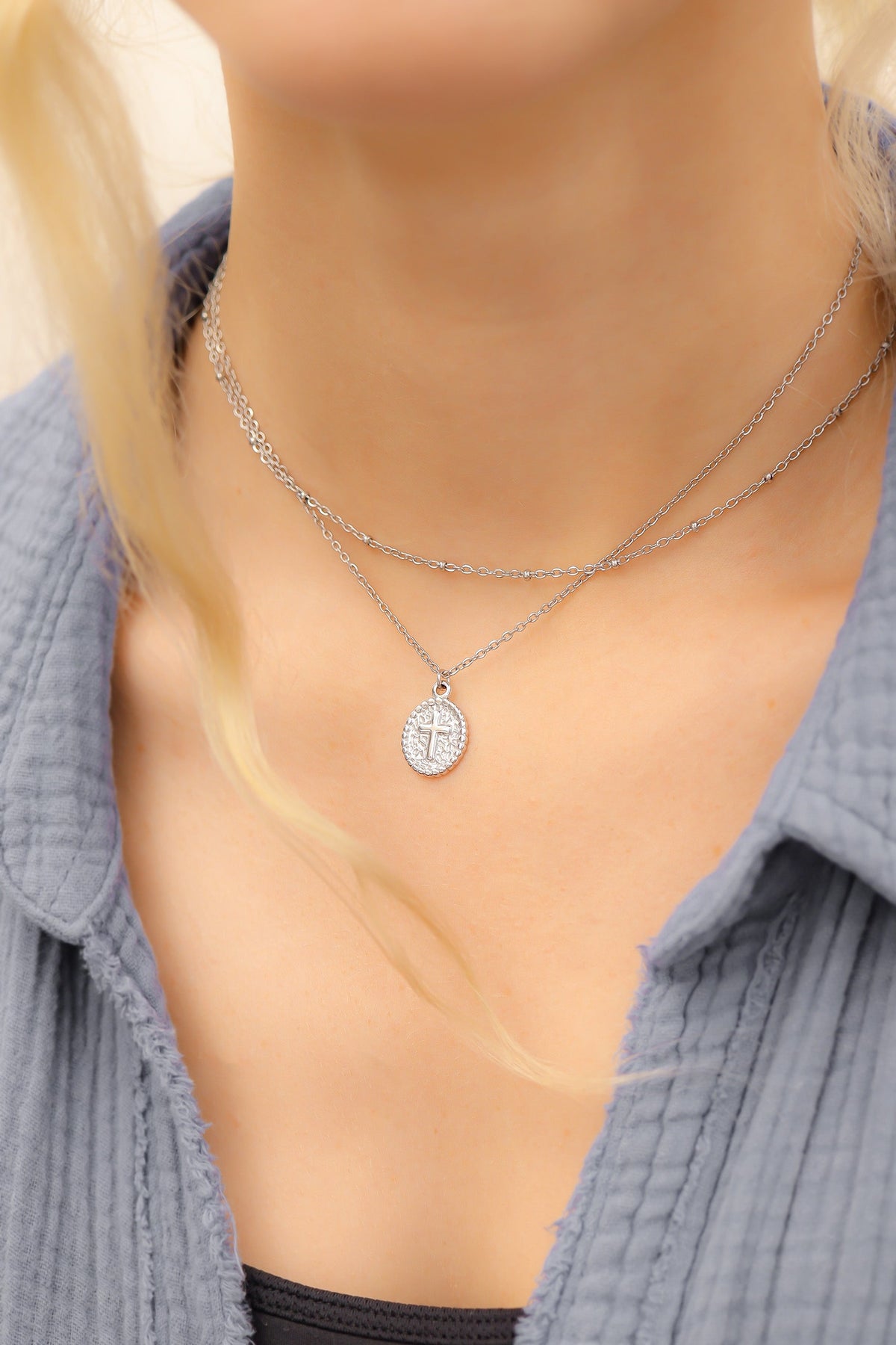 Textured Medallion Cross Charm on necklace alternate angle