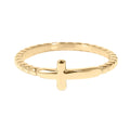 Gold ring with a cross design on a white background