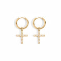 A pair of gold hoop earrings with dangling cross charms, each adorned with small clear stones, shown on a clean white background.