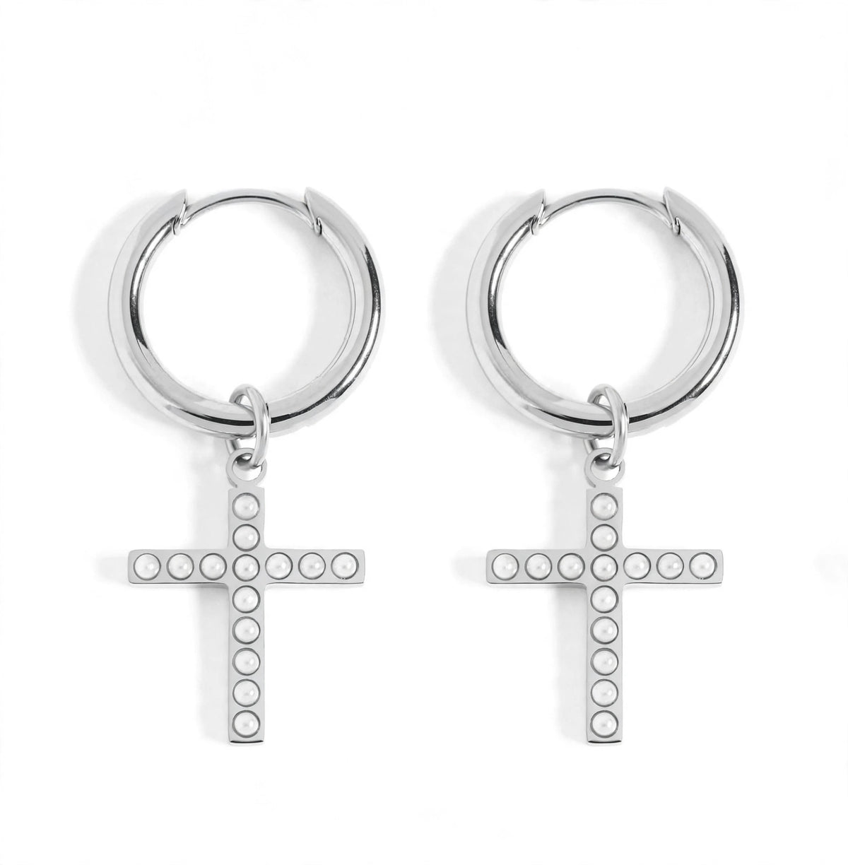A pair of silver hoop earrings with dangling cross charms, each cross adorned with small circular pearl stones, shown on a plain white background.