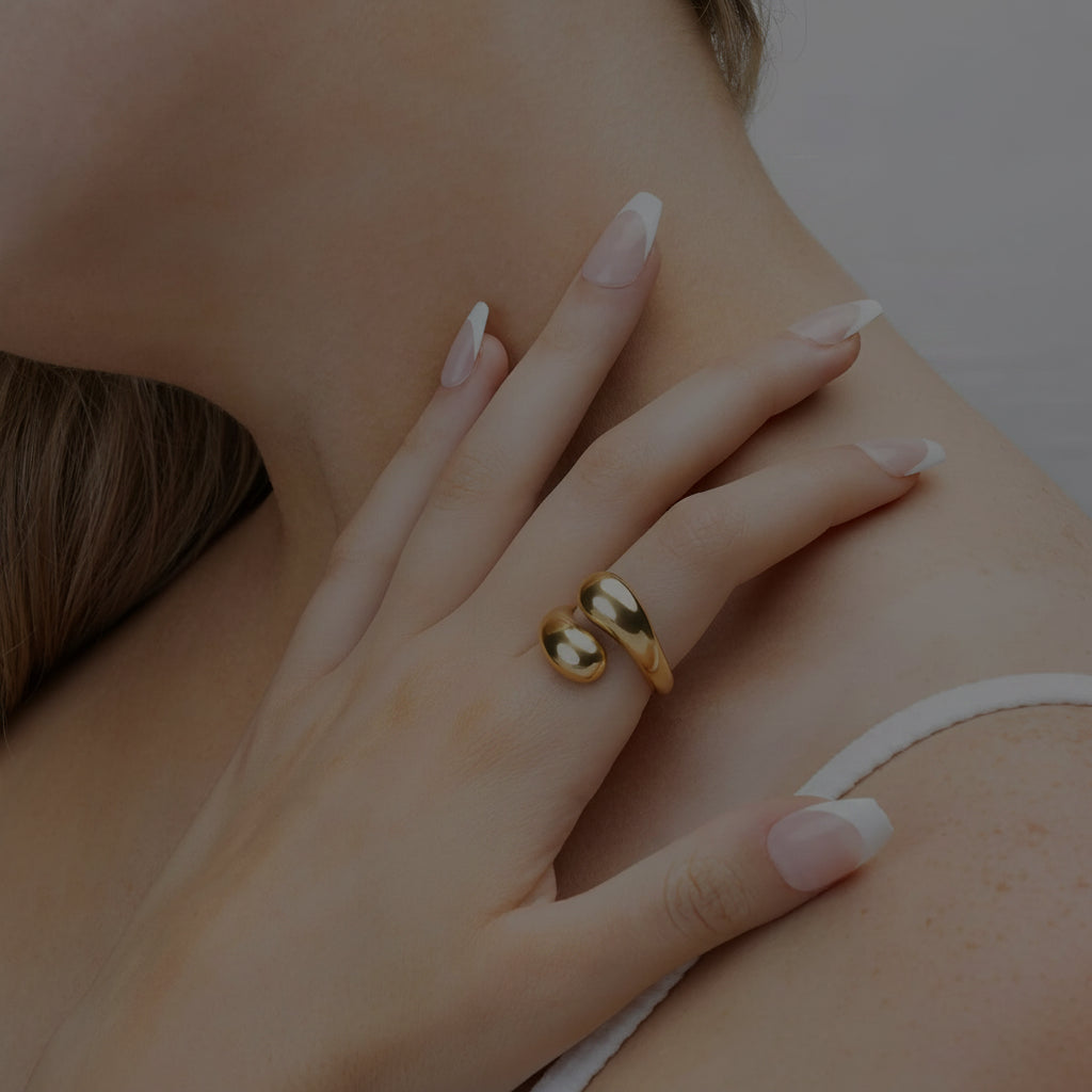 Crescent gold ring on model.