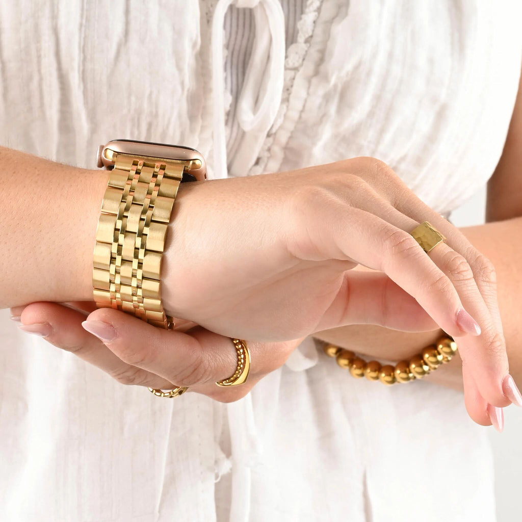 Garden Link Apple Watchband in gold, worn on wrist