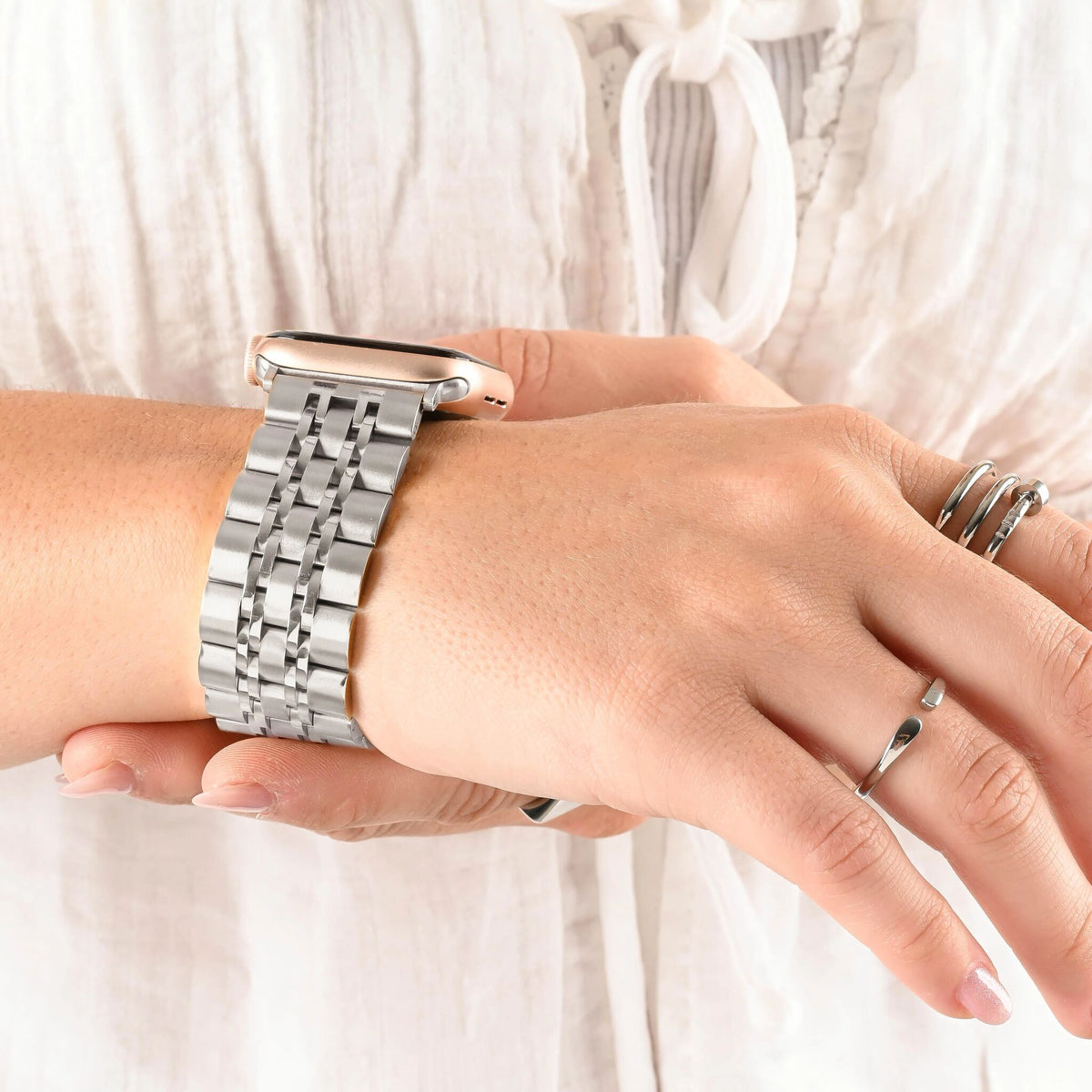 Garden Link Apple Watchband in silver, worn on wrist
