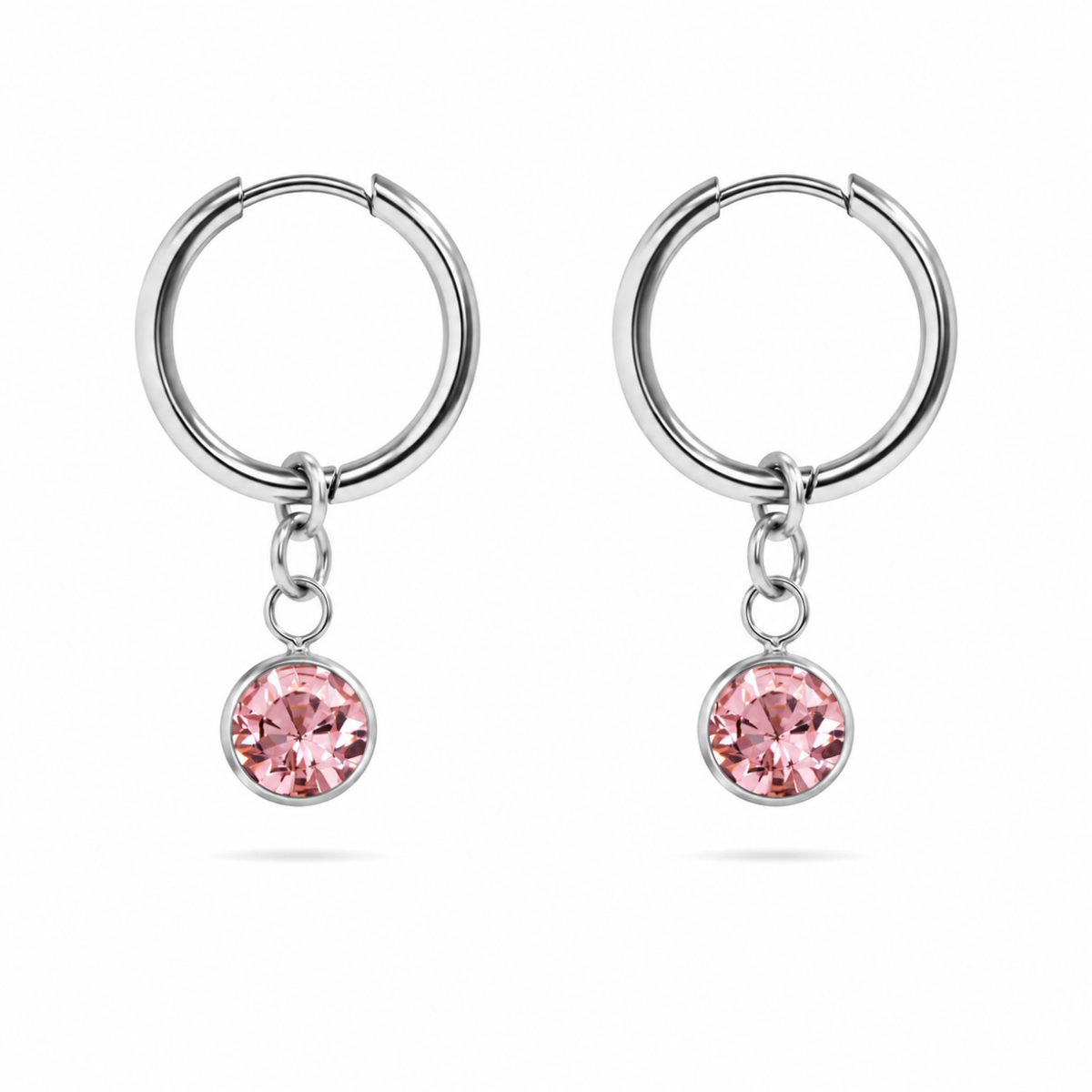Silver Earrings with pink Crystal on white background 