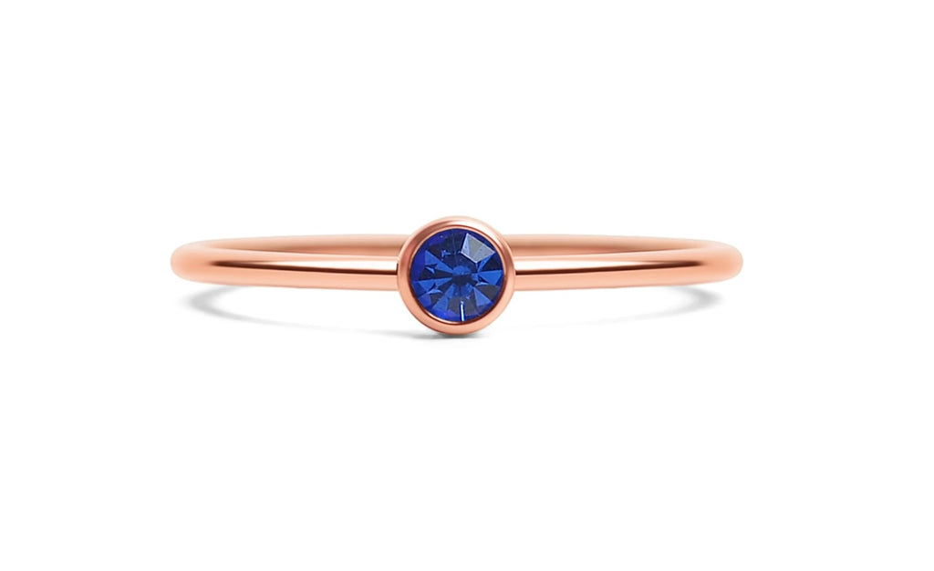 The Addison Stack Ring shown stacked with other rings, from Garden District Jewelry