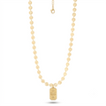 The Mayfair Pendant Necklace, a gold pendant necklace from Garden District Jewelry, styled product image.