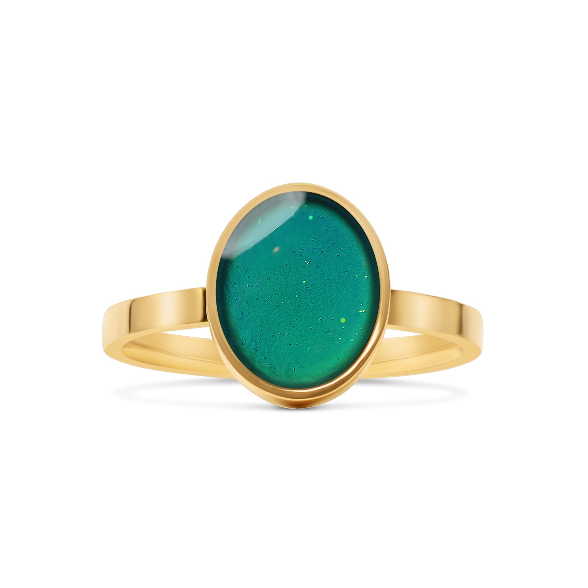 Gold moon ring with a green stone on a white background