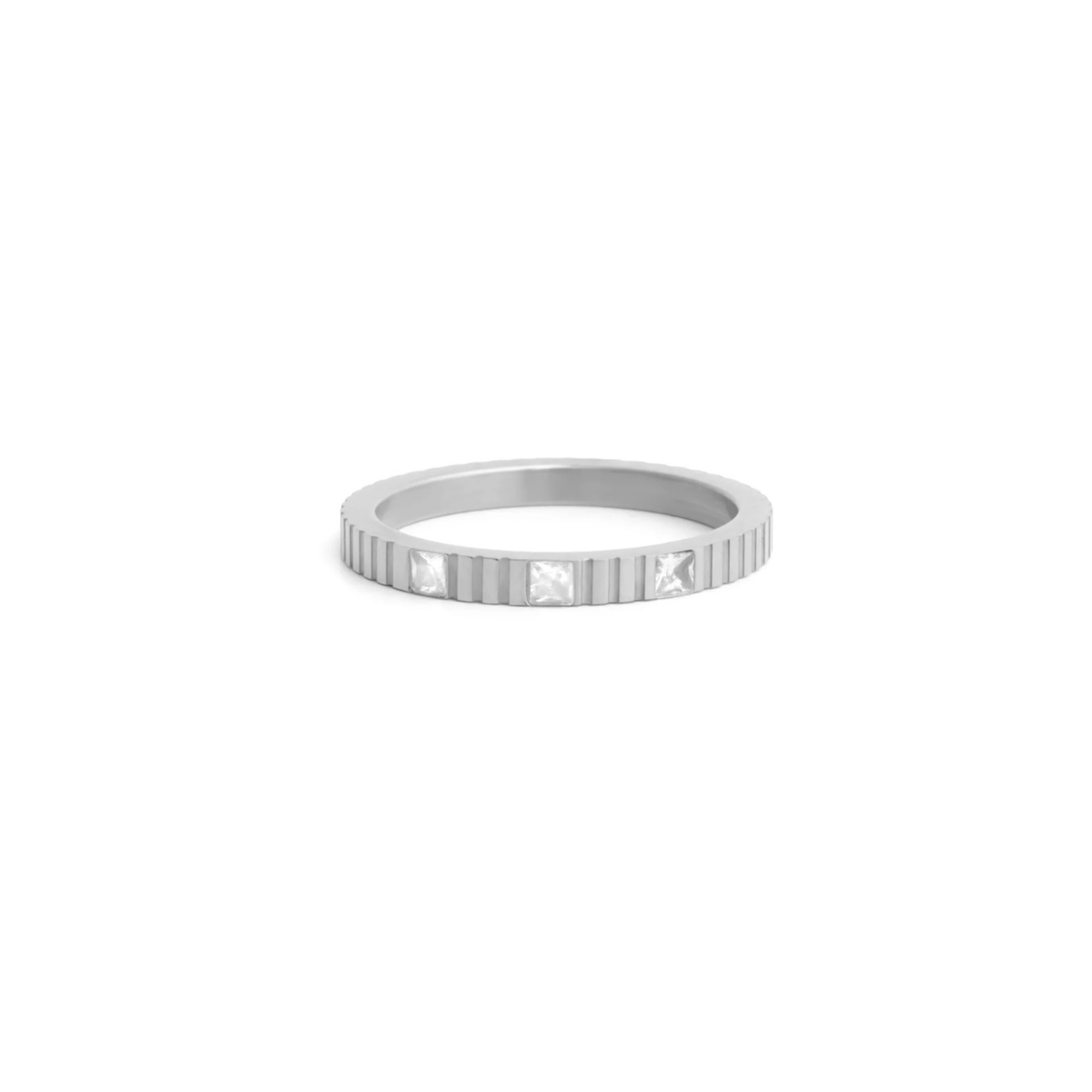 Close-up of the Nicole Stacking Ring showing the faceted stone accent and polished band detail