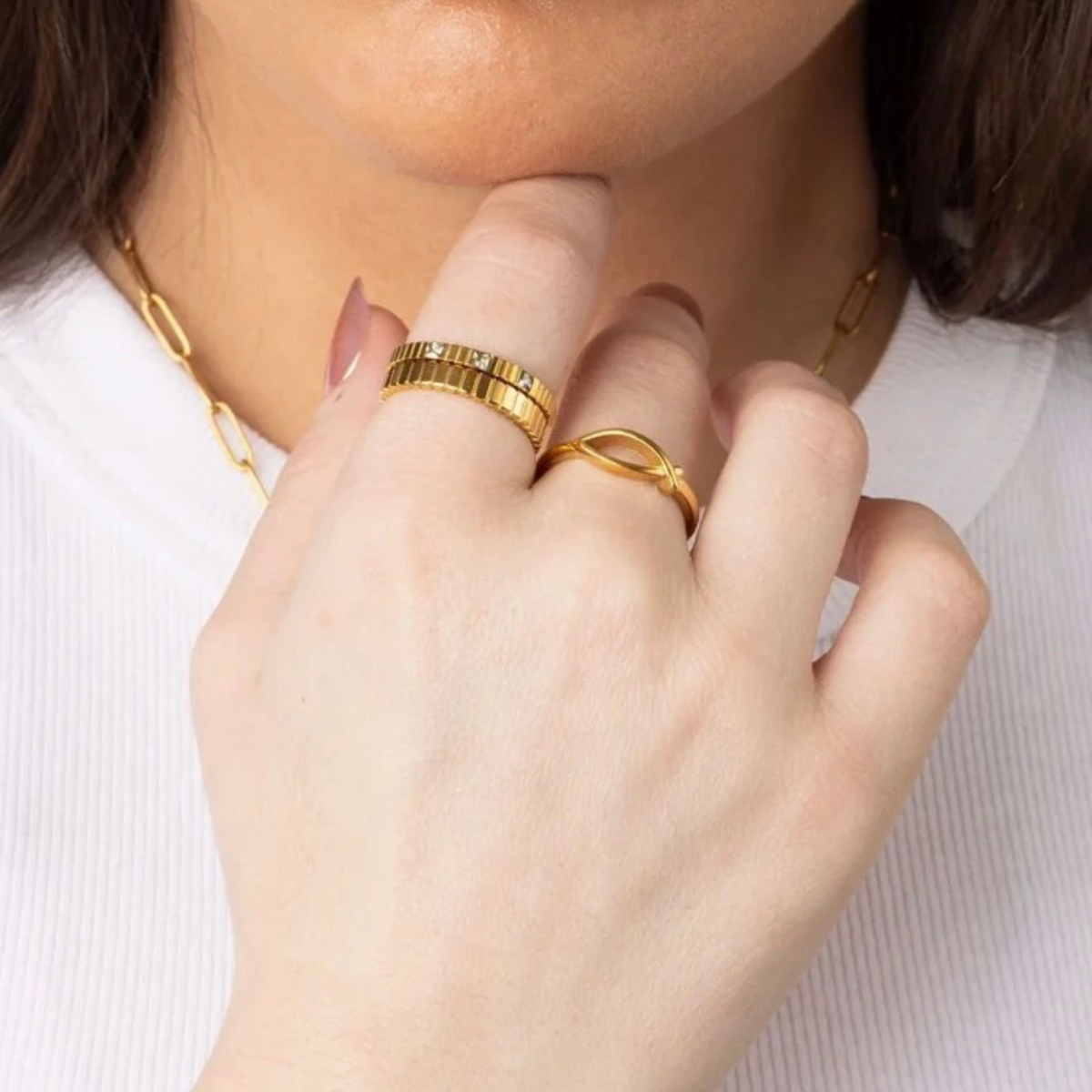 Nicole Stacking Ring worn on a hand, layered with other stacking rings