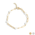 Gold bracelet with pearls on a white background
