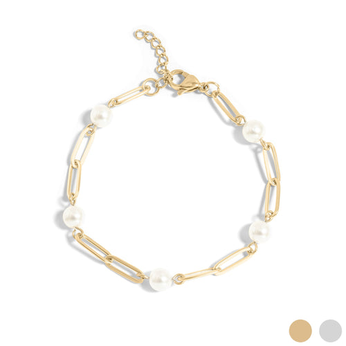 Gold bracelet with pearls on a white background