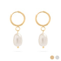 Gold hoop earrings with pearl drops on a white background