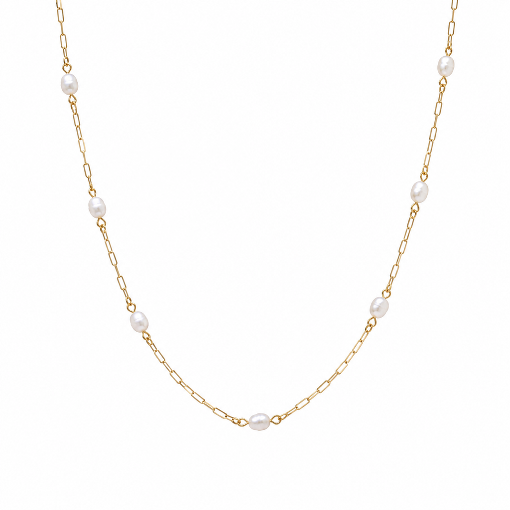 The Josephine Street Station Pearl Necklace in gold, a long-length pearl station necklace from Garden District Jewelry.