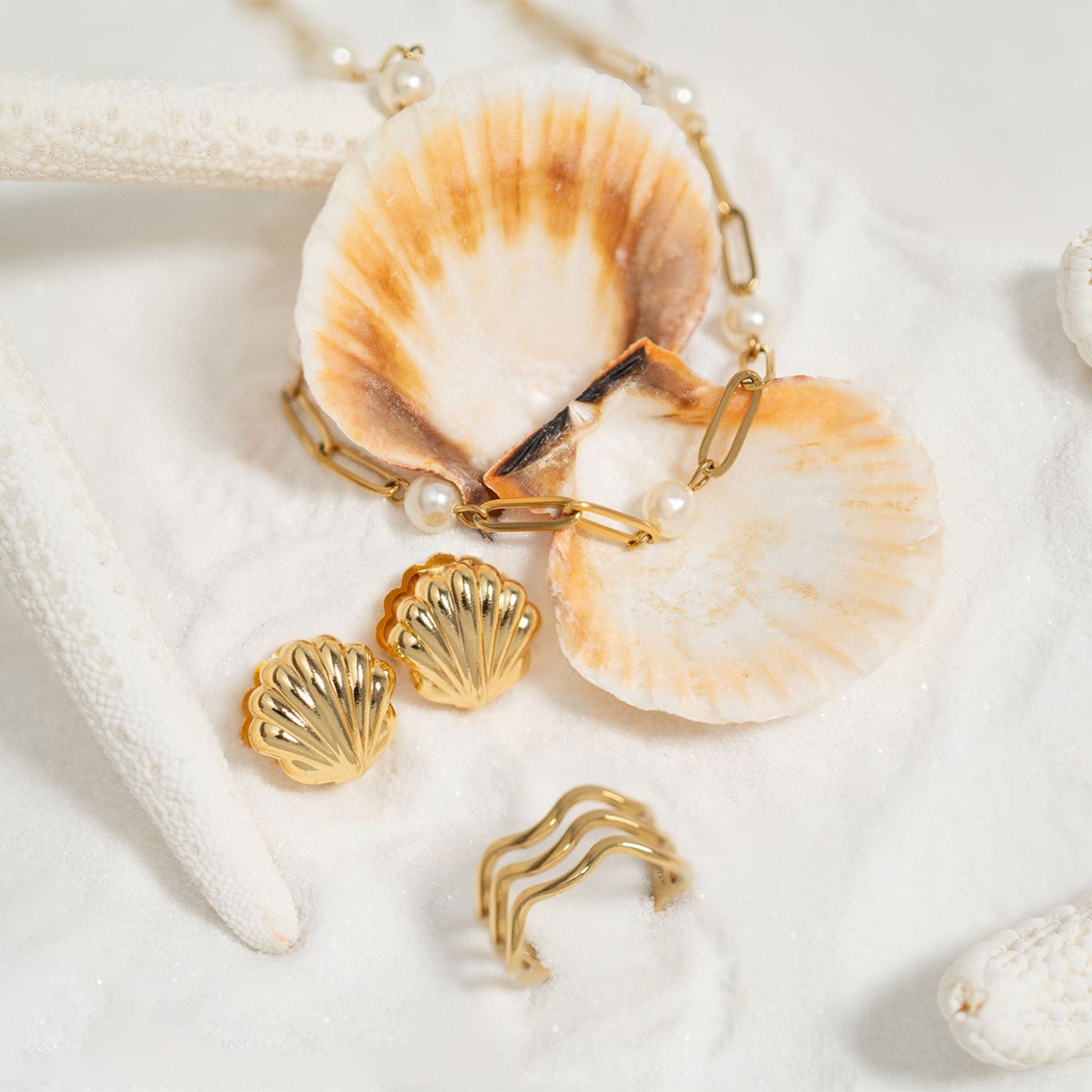 Bracelet with shell charms on a white background