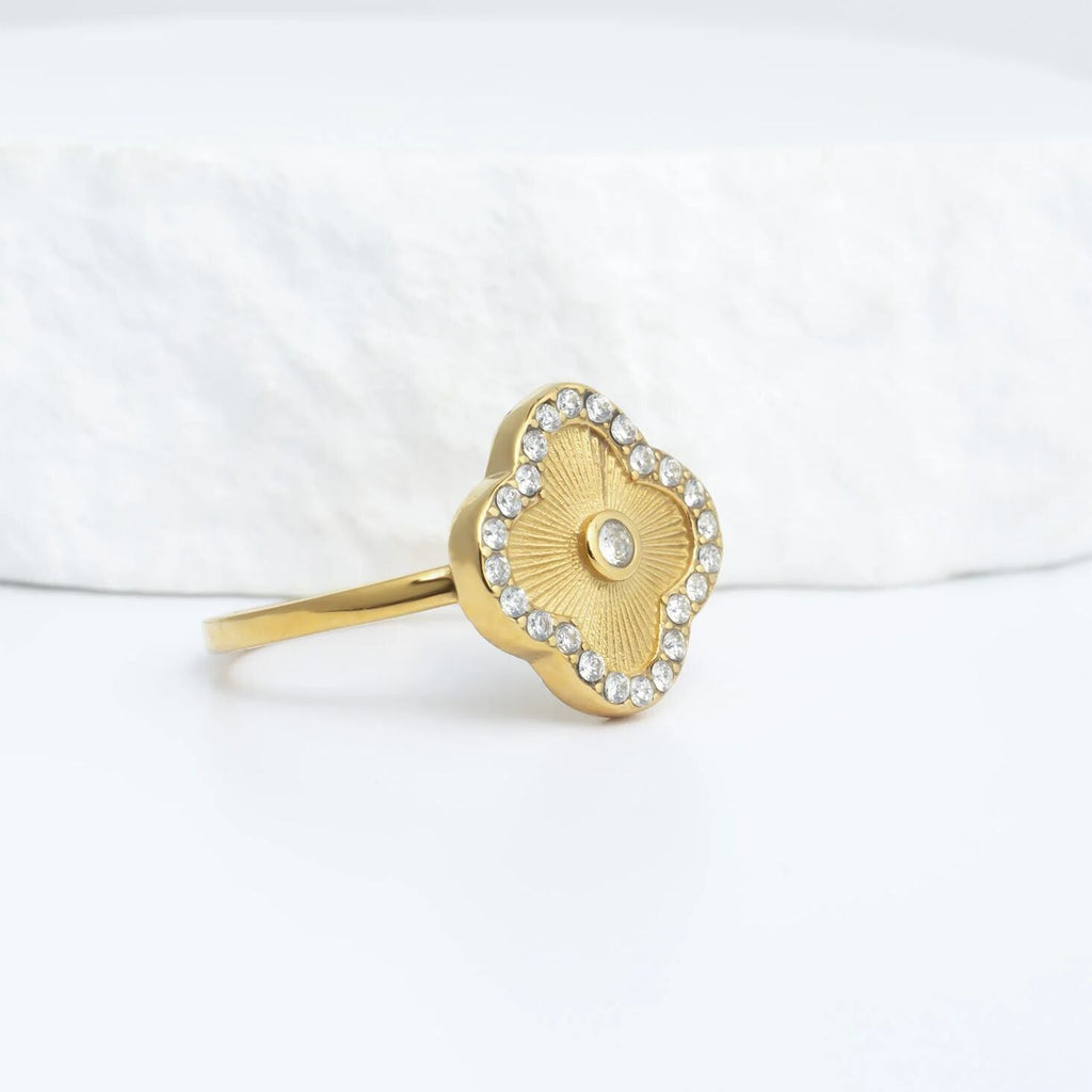 Gold floral motif stacking ring studio shot