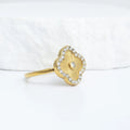 Gold floral motif stacking ring studio shot