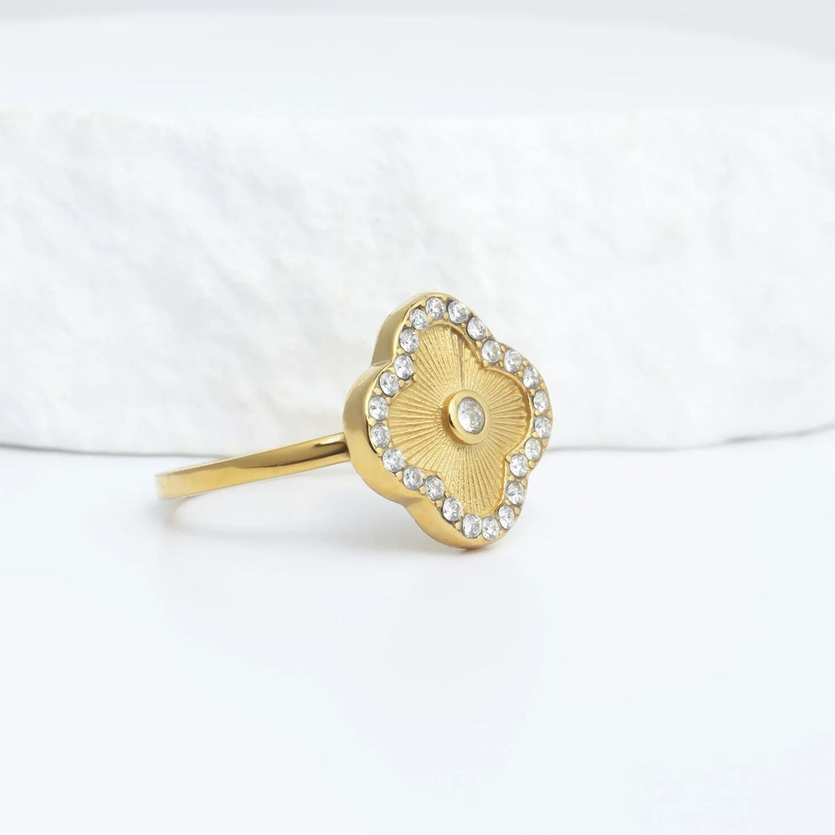 Gold floral motif stacking ring studio shot