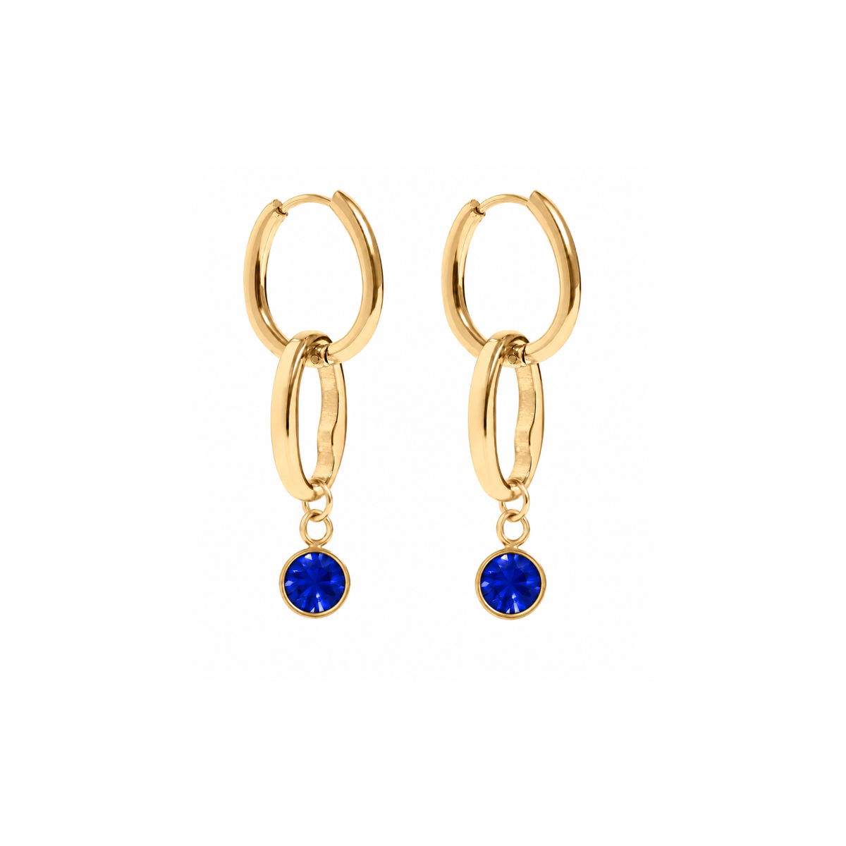 A pair of gold huggie hoop earrings with a double-ring design and a dangling round blue gemstone, shown on a plain white background.