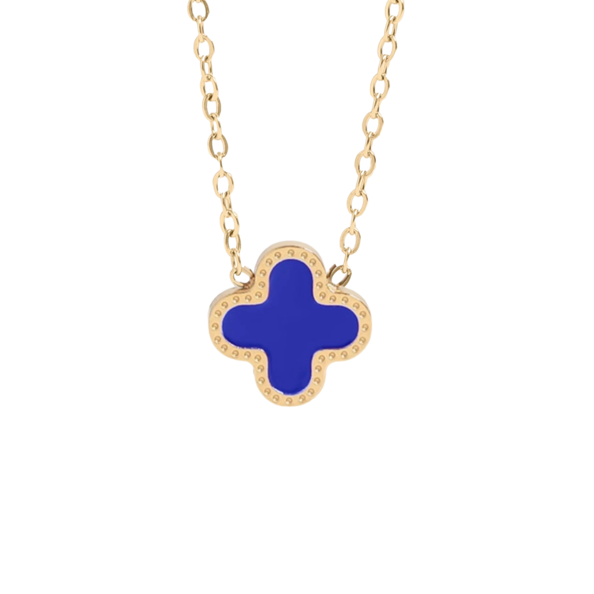 Maeve Necklace from Garden District Jewelry in Blue.  Gold-tone necklace featuring a clover-shaped pendant with a vibrant blue enamel center and a border of small clear stones, shown against a plain white background.