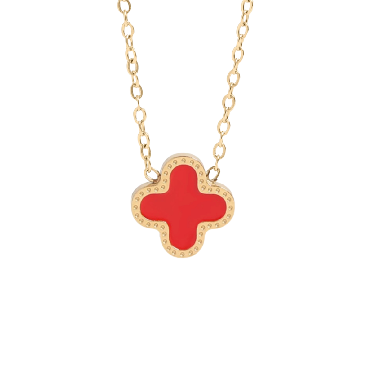 Maeve necklace in Red.  A gold-tone necklace featuring a clover-shaped pendant with a vibrant red enamel center and a border of small clear rhinestones, shown against a plain white background.