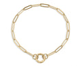 A gold paperclip chain bracelet with a double-ring charm holder clasp, displayed on a clean white background.