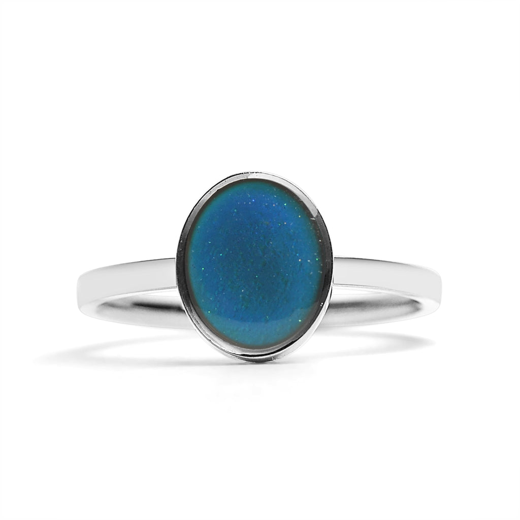 Silver mood ring with a blue stone on a white background