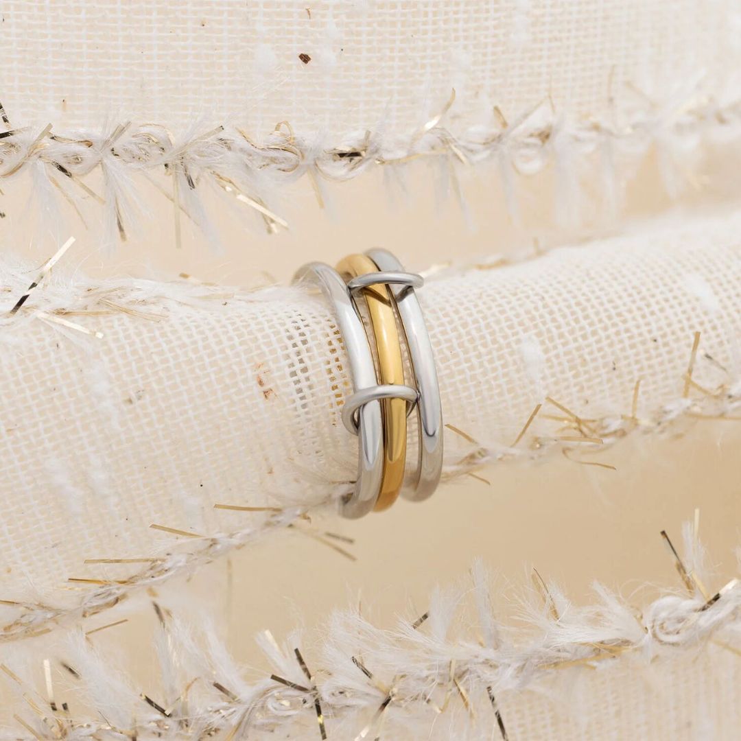 Camp Street Mixed Metal Triple Intertwined Ring, a two-tone gold and silver ring from Garden District Jewelry — product photo 4 of 4.