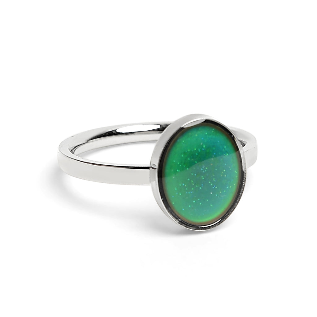Silver mood ring with a green gemstone on a white background