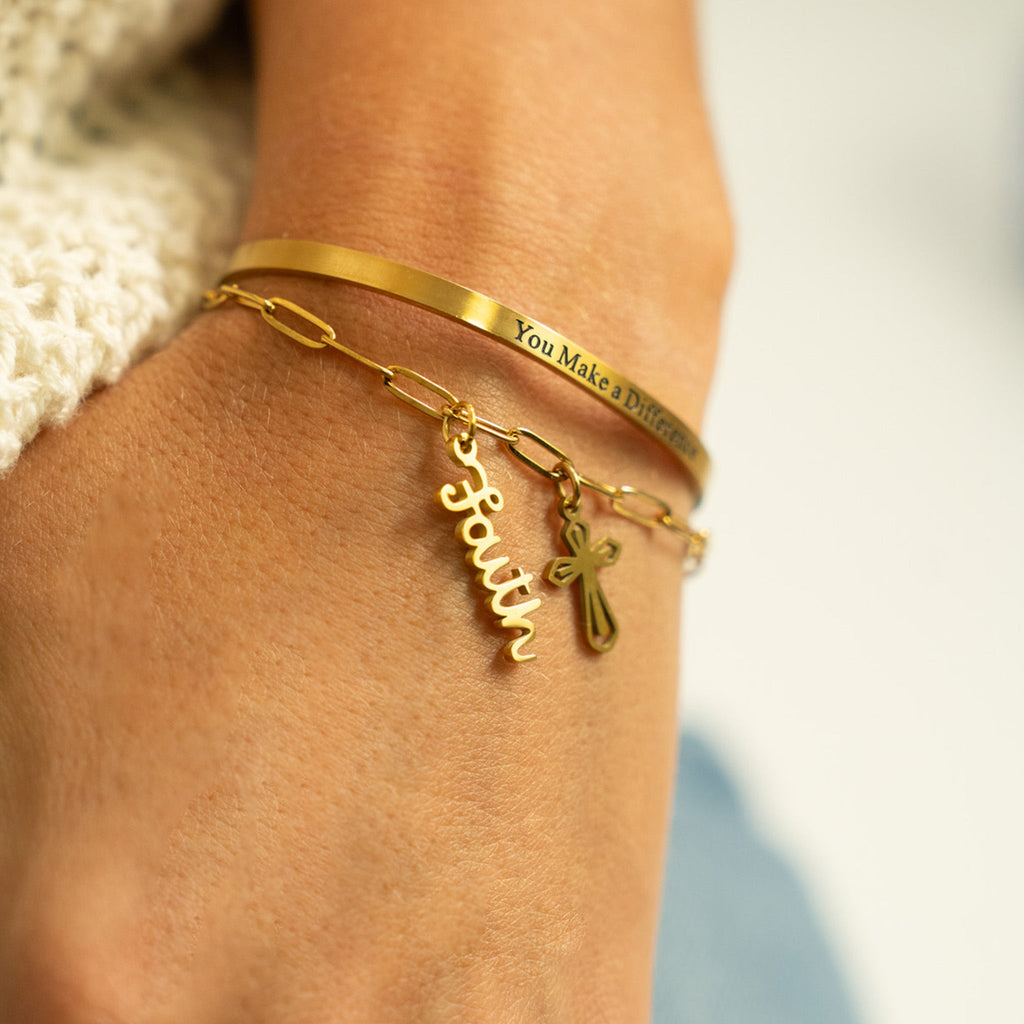 Gold Faith Charm on bracelet lifestyle