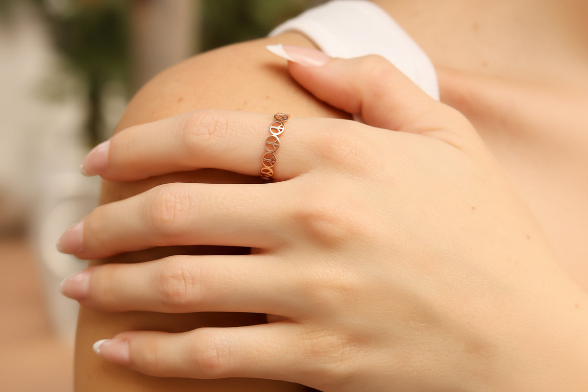 Peace sign stacking ring on hand
