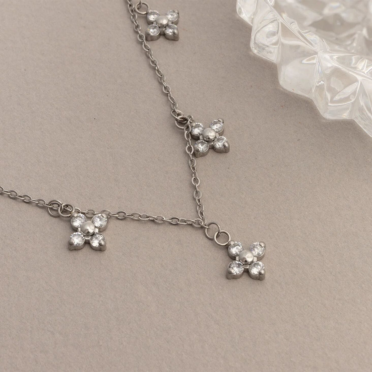 Silver CZ dangle floral necklace studio shot