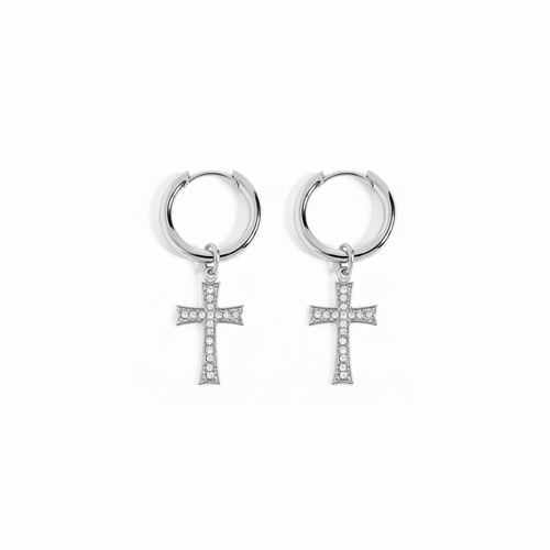 A pair of silver hoop earrings with small cross pendants paved with clear stones, shown on a plain white background.