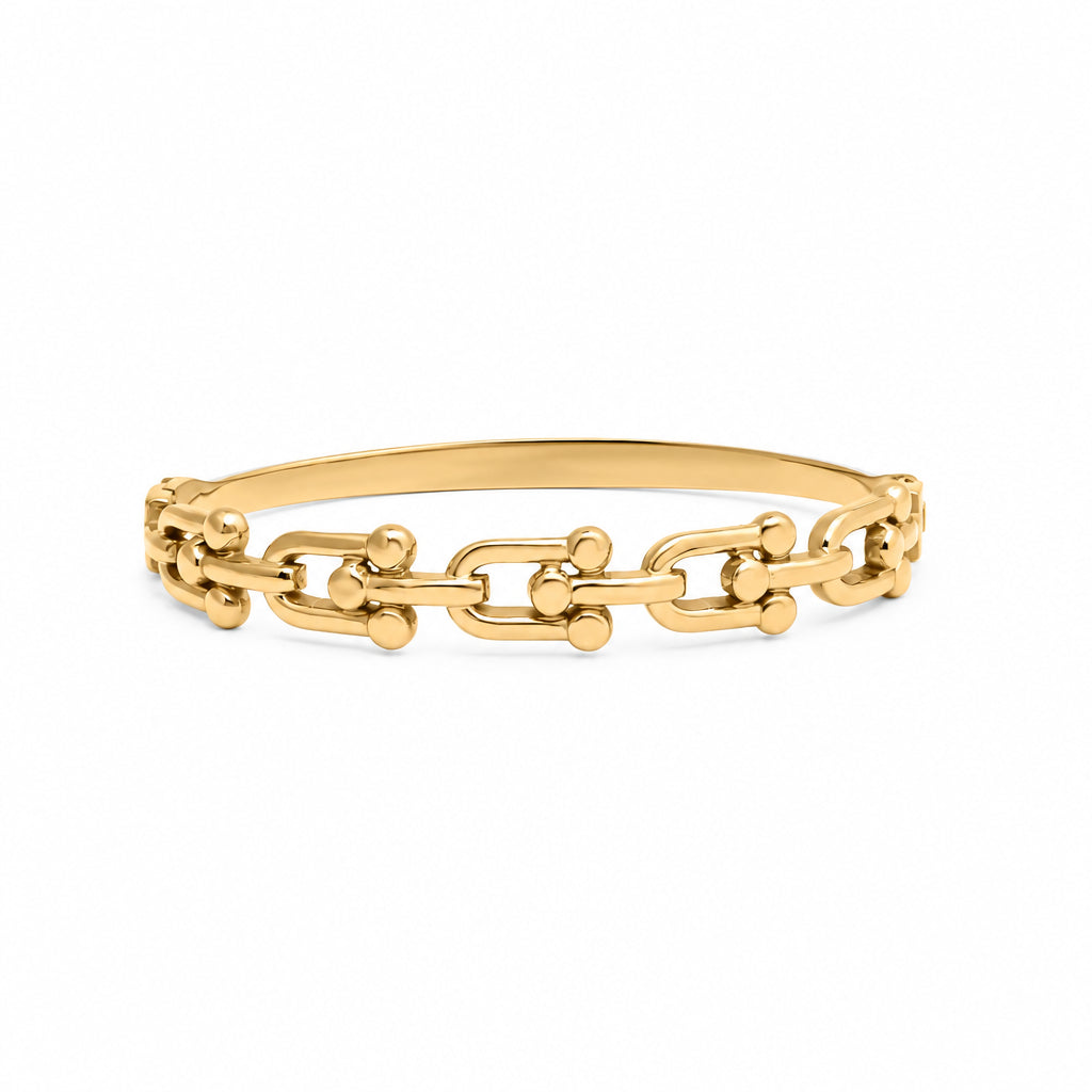 Gold hardware bangle bracelet on a white background