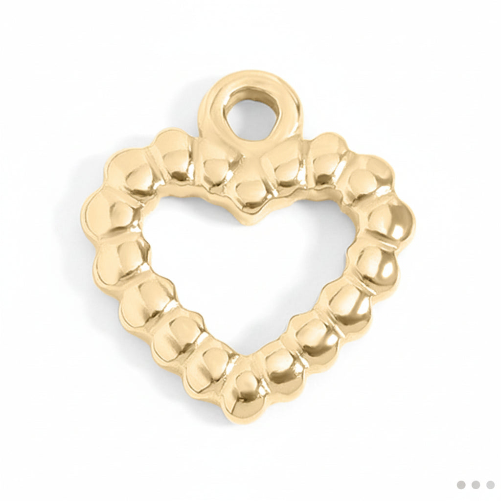 Gold heart-shaped charm on a white background