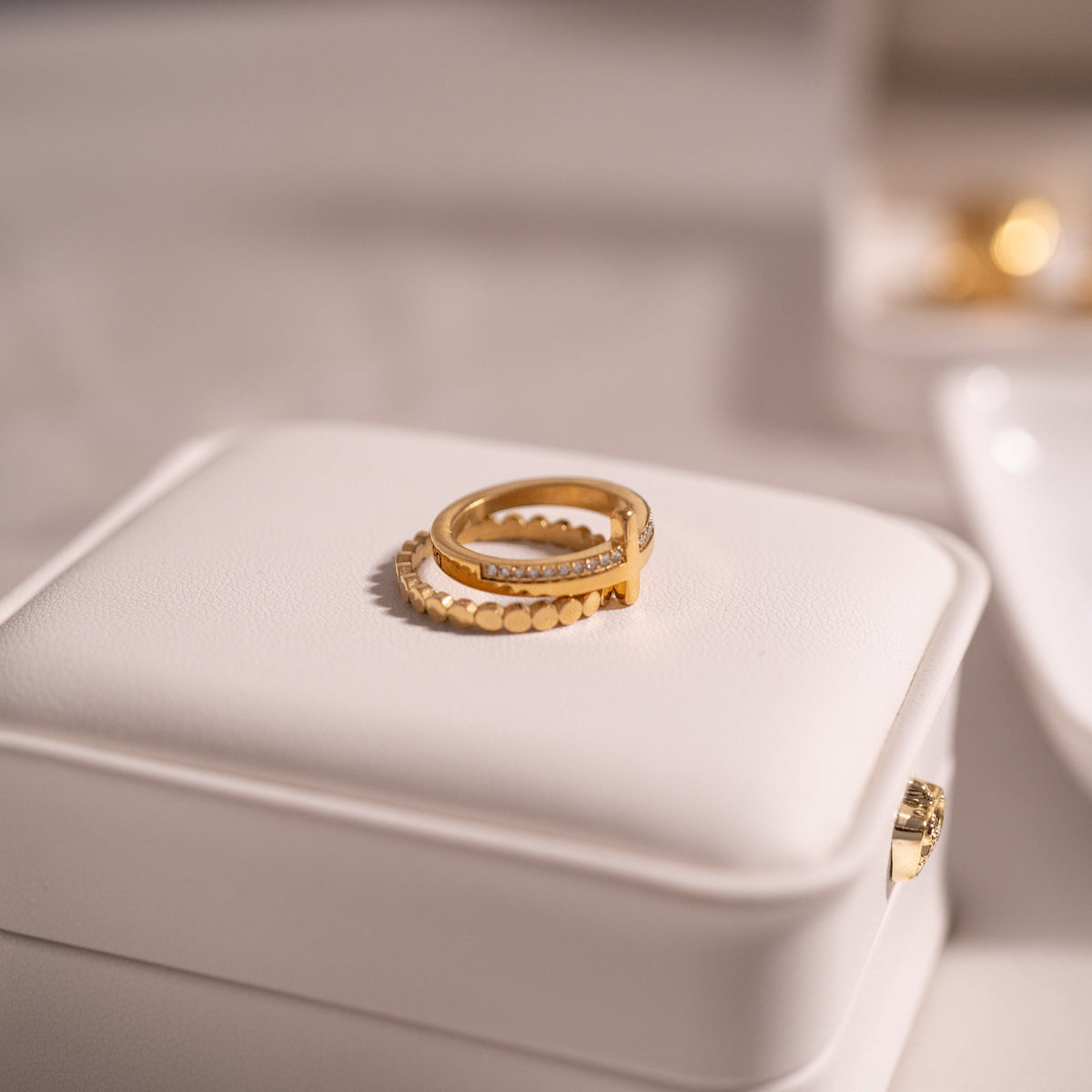 Cathedral Cross Ring with Stones, a gold cross ring set with cubic zirconia stones, from Garden District Jewelry — product photo 10 of 11.