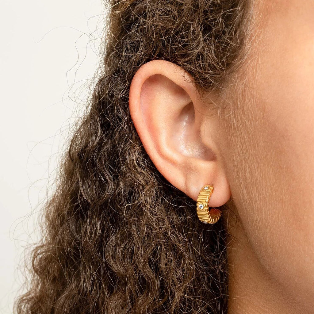 The Coliseum Fluted Huggie Earrings